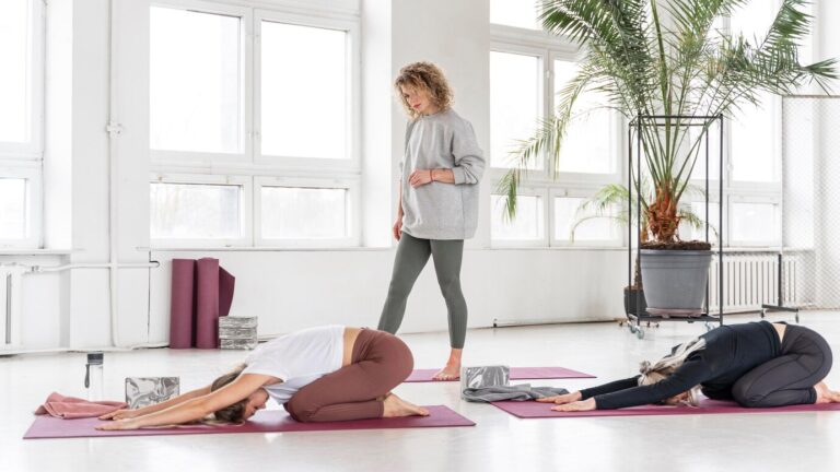 Full shot teacher watching women stretching 23 2148924636