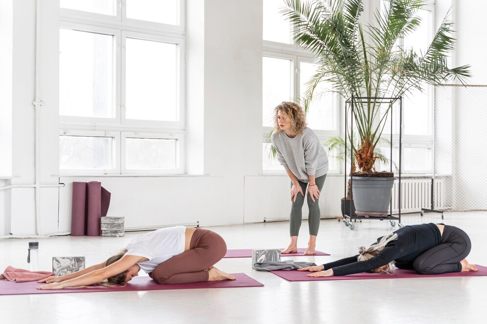Teacher watching women stretching 23 2148924635